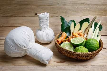 Spa herbal treatment on wood backgroundの写真素材