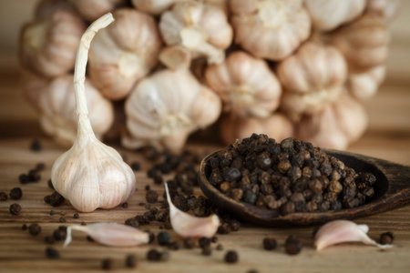 Dried Garlic and pepper on wood backgroundの写真素材