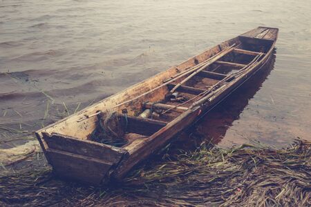 Retro Old fishing boat on the reservoir, vintageの写真素材