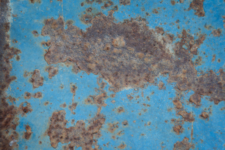Background rusted metal on blue painted wall textureの写真素材