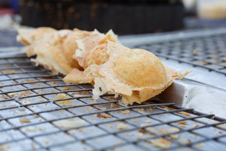 Knmcrk, Thai sweetmeat, made from flour, sugar and coconut milk on board at market thailandの写真素材
