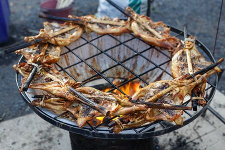 Grilled chicken, cooking chicken on the grill at marketの写真素材
