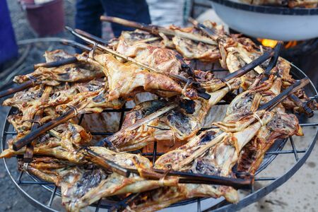 Grilled chicken, cooking chicken on the grill at marketの写真素材