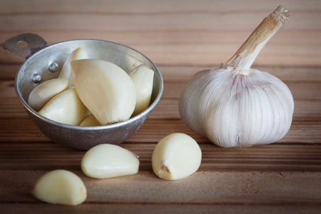 Dried Garlic on wood background