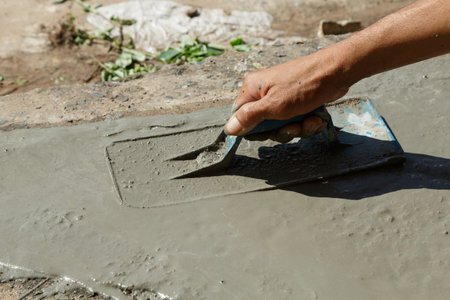 Hand masonry cement plastering work. with hight contrast lightting