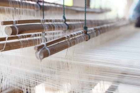 Close up loom with white yarn