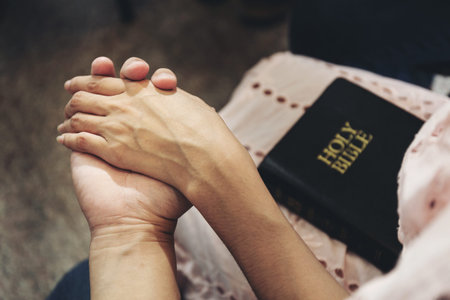 People hold hands to pray for God's blessing.