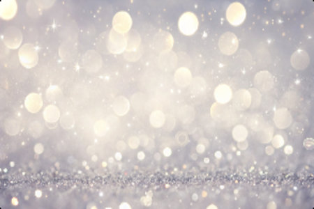 An abstract background is blurred to create a shimmery silver look with glitter sparkles. This festive and celebratory background has many commercial uses, including product advertising, seasonal greetings, and event promotions.の素材
