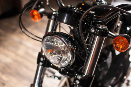 Headlights of motorcycles in a shopの写真素材