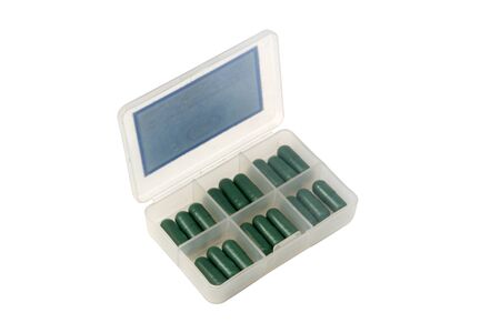 Green capsules in Pill box on white backgroud. included clipping path.の写真素材