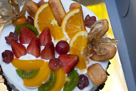 Fruit cake with orange, kiwi, grapes, strawberry の写真素材