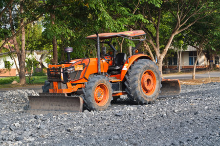 The tractor gravel Rouge in Football field の写真素材