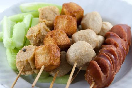 Meat Ball and sausage fried on white dish の写真素材