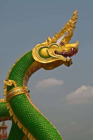 Naga statue on the riverside in Thailand.の写真素材