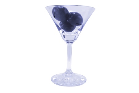 Black grapes in glass on white background.の写真素材