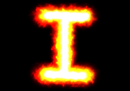 Character  I  of fire on black background の写真素材