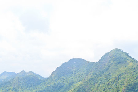 Mountain landscape in the day, the sky is cloudy.