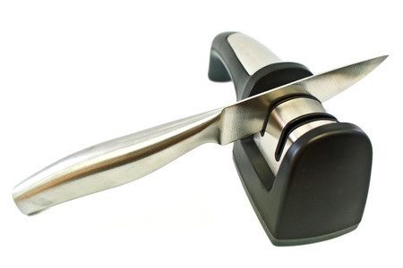 Whetstone knife using the handle on white background の写真素材