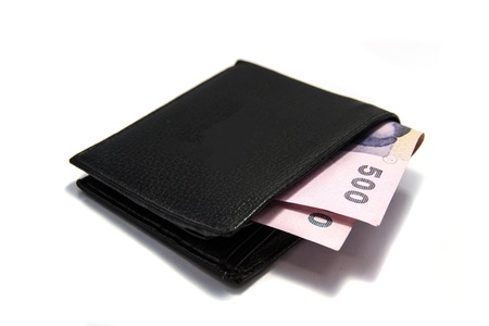 Wallet and bank notes on white background の写真素材