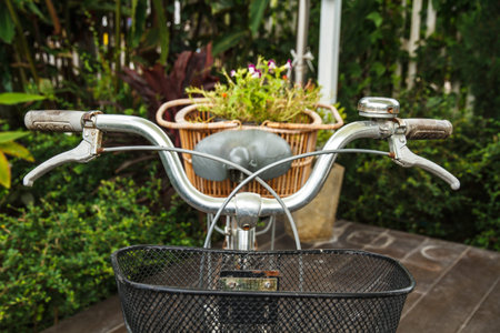 Old black bicycle and flower baskets の写真素材
