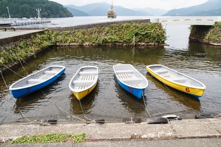 Many small rowing boats tied to the shore line.の写真素材