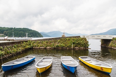 Many small rowing boats tied to the shore line.の写真素材