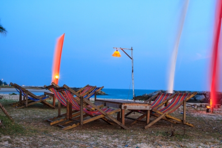 Seating for dinner on the beach in the evening after sunset.の写真素材