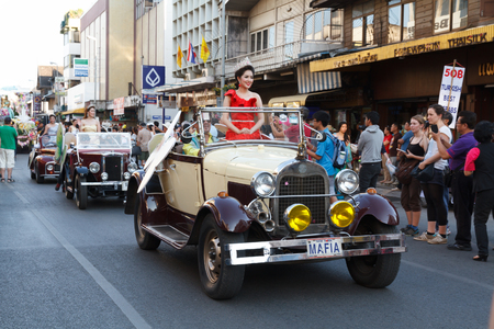 CHIANGMAI, THAILAND - FEBRUARY 8 : People march in celebration in Gate Tapae in Chiang Mai Flower Festival on February 8, 2014 in Chiang Mai, Thailand.のeditorial素材