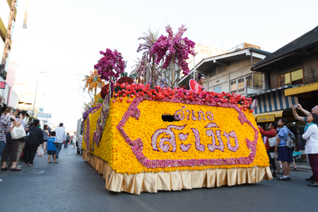 CHIANGMAI, THAILAND - FEBRUARY 8 : People march in celebration in Gate Tapae in Chiang Mai Flower Festival on February 8, 2014 in Chiang Mai, Thailand.のeditorial素材