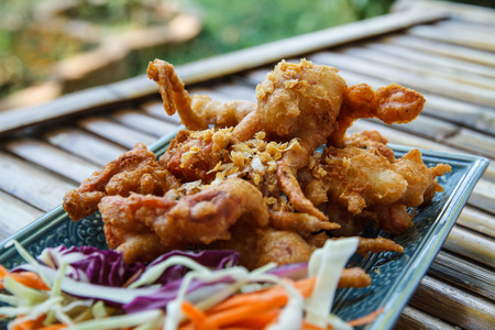 Soft Shell Crab fried with garlic on plate in restaurant.の写真素材