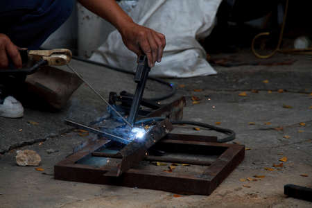 Workers are welding steel at the work 