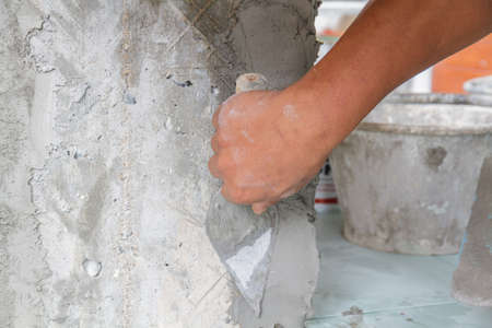 Workers were plastering on pile in houses.の写真素材