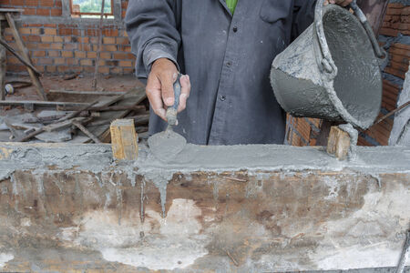Workers were plastering on wall in houses.の写真素材