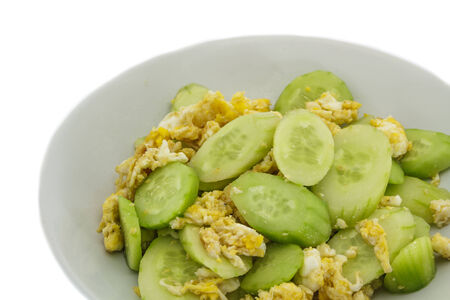 Stir cucumber and egg on the plate.の写真素材