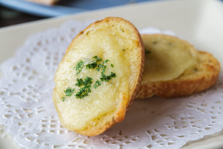 Cheese toast on white dish in restaurant