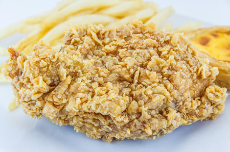 Chicken fried, Tart egg and French Fries on plate.の写真素材