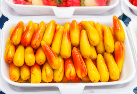 Deletable imitation fruits sell in market. Make by nut and jelly. Dessert of Thailand we call Look choup.の写真素材