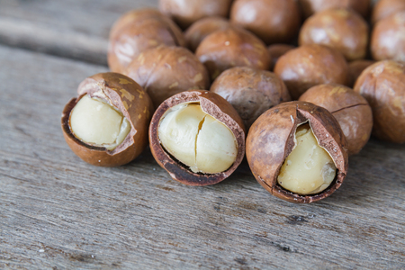 Macadamia nut on a wooden table.の写真素材