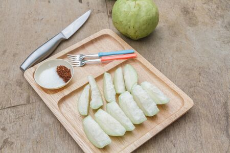 Guava and sugar chili sauce in wooden dish on wood table.の写真素材