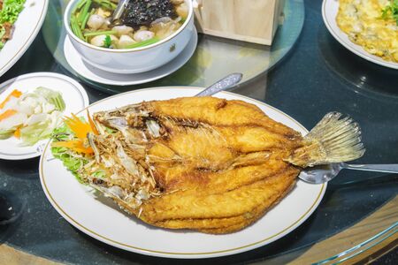Snapper fish fried with fish sauce at china restaurant.の写真素材