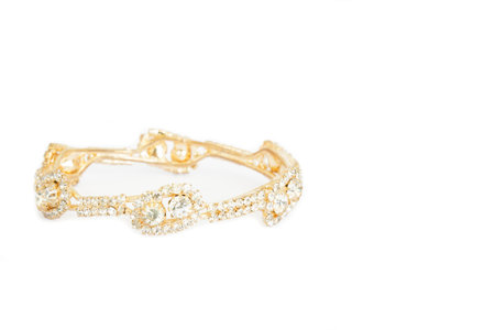 Gold bracelets with gem and diamonds isolate on white background.
