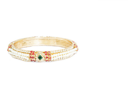 Gold bracelets with gem and diamonds isolate on white background.
