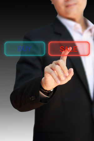 Business man finger pointing to choose SALE.の写真素材