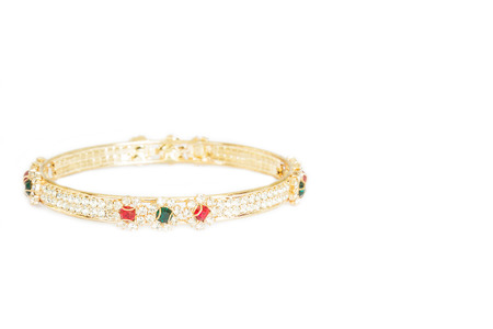 Gold bracelets with gem and diamonds isolate on white background.の写真素材