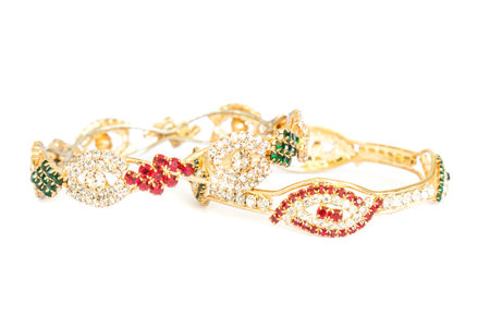 Gold bracelets with gem and diamonds isolate on white background.