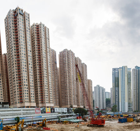 HONG KONG, CHINA â€“ APRIL 23: Construction cranes are working on April 23, 2016 in Hong Kong,...