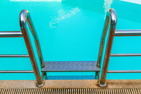 Stairs into the pool in hotel thailand with copy space.の写真素材