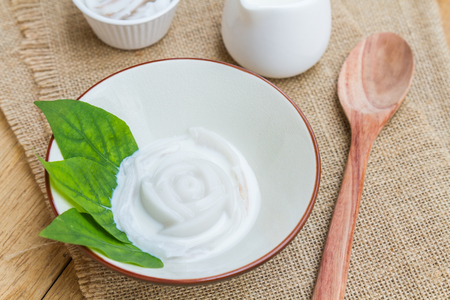 Coconut jelly coconut milk in cup on wood background local dessert thailand.の写真素材