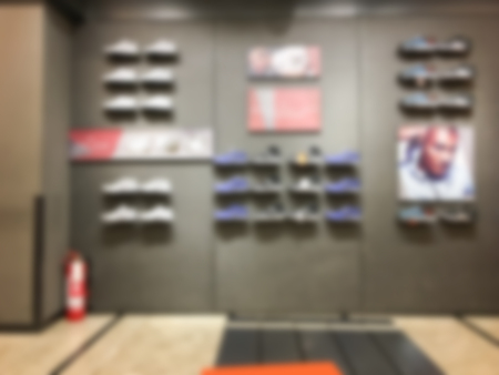 Defocused blur footwear sport store in shopping mall. Blurred background.の写真素材