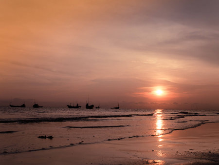 Sunset at the sea and boat with copy space at Chao Lao Beach, Chanthaburi Province, Thailand.の写真素材